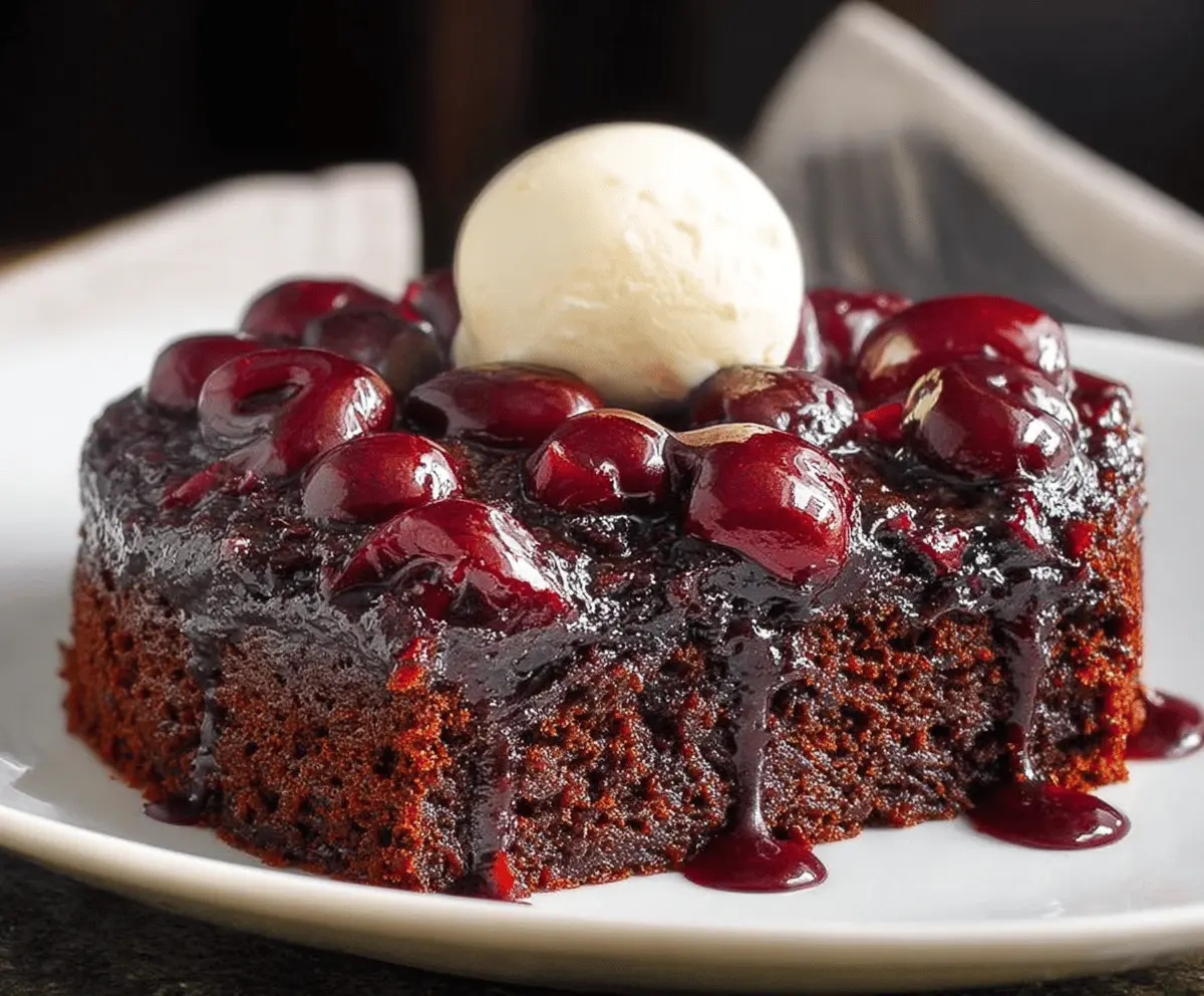 Delicious chocolate cherry upside down cake topped with fresh cherries and rich chocolate glaze, perfect for dessert lovers