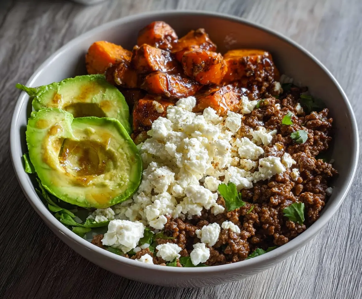 Healthy Ground Beef Power Bowl topped with fresh avocado and cottage cheese for a nutritious meal.