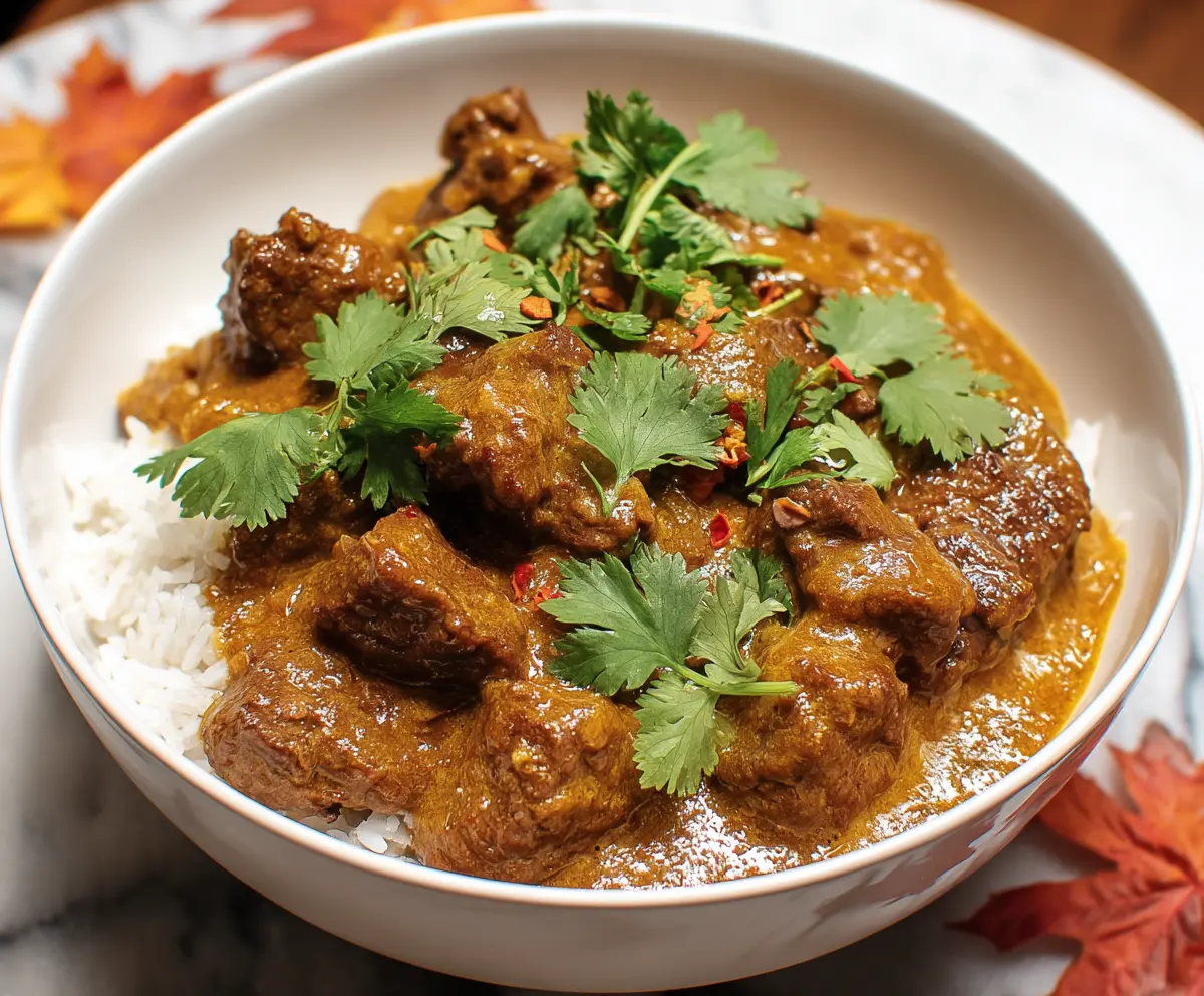 Delicious slow cooker beef coconut curry with tender meat and rich coconut sauce served in a bowl