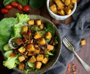 Crispy herby plantain croutons seasoned with fresh herbs for salads and snacks.